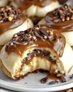 Delicious Caramel Cheesecake Cookies topped with caramel drizzle