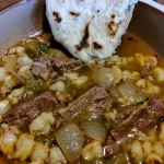Delicious Christmas Style Steak Posole served in a festive bowl