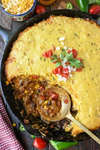 Delicious Cowboy Cornbread Casserole served in a dish with toppings