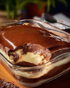 Delicious layered chocolate dessert with rich chocolate cream and toppings