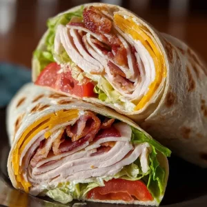 Delicious Turkey Ranch Club Wrap with turkey, ranch dressing, and fresh vegetables
