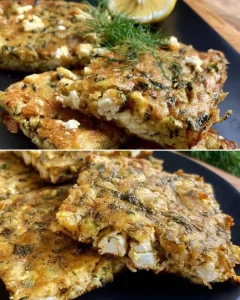 Zucchini and feta cake slice on a plate, garnished with herbs.